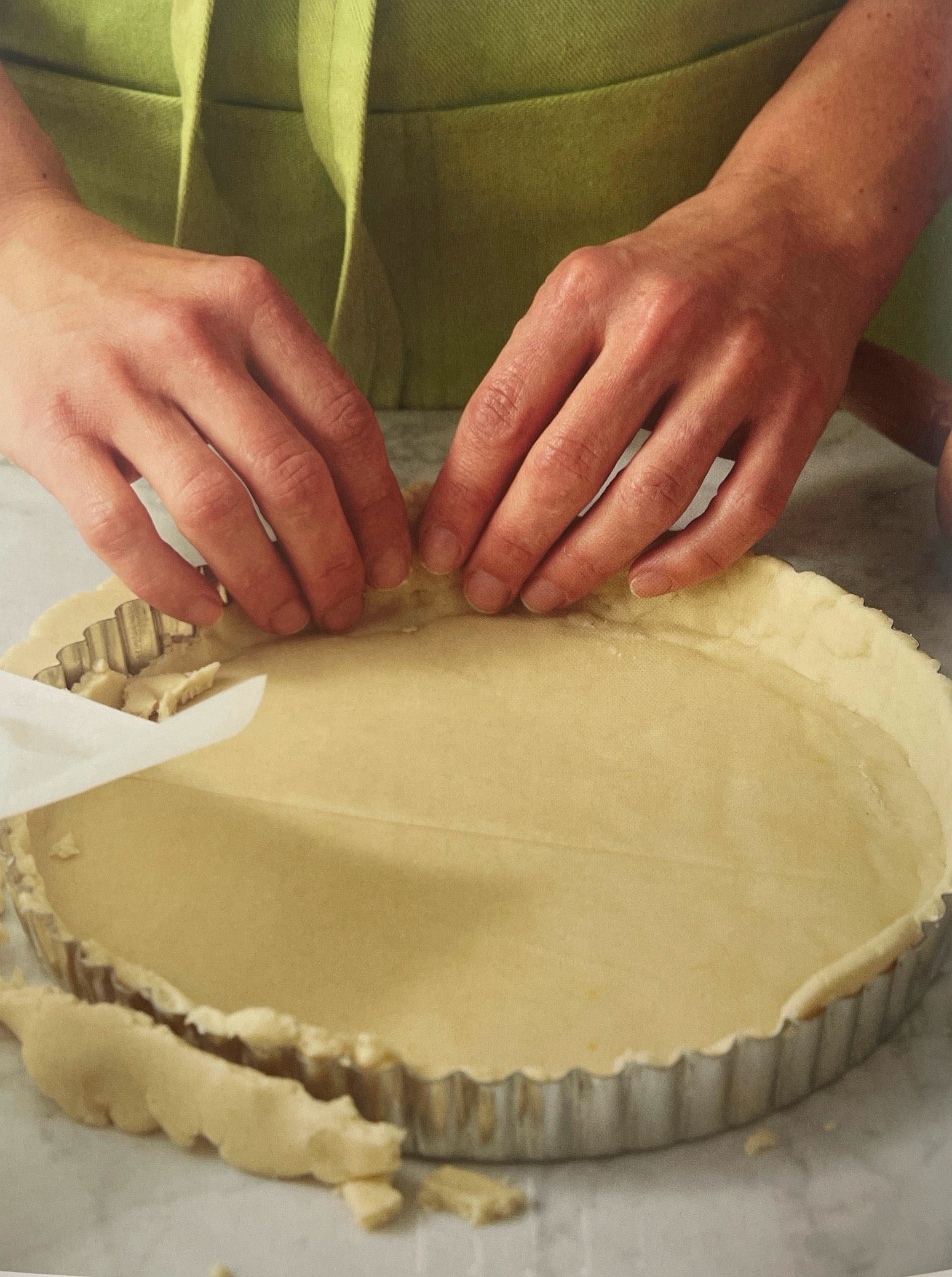 Cybele's hands molding pie crust to pie pan